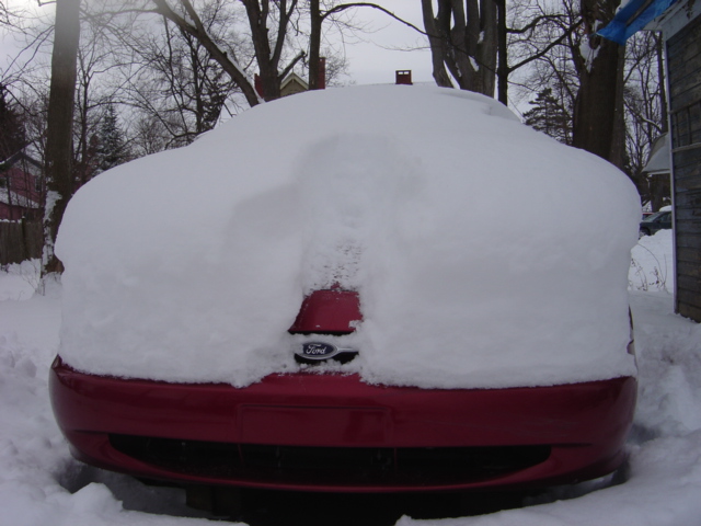 1998 Ford Taurus rear covered in heavy snow