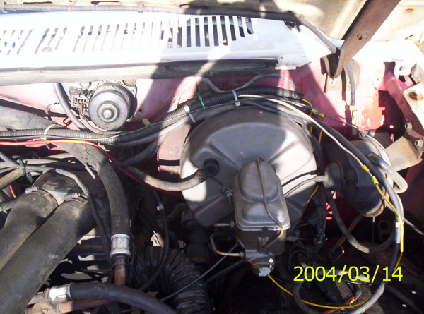 Engine bay firewall view showing brake booster, master cylinder, wiper motor, hoses and wiring; dated 2004/03/14.
