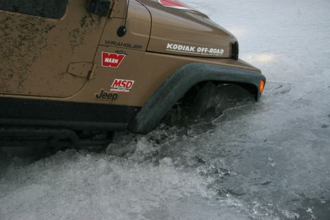 2003 Jeep TJ - Jeep Wrangler TJ stuck in ice, showing KODIAK OFF-ROAD and WARN decals.