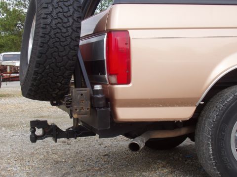 1994 Ford Bronco - Rear bumper and spare tire carrier on a Ford Bronco, likely from the 1992-1996 generation.