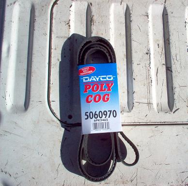 1988 Ford Bronco - A Dayco Poly Cog serpentine belt, part number 5060970, is shown on a white ribbed surface.