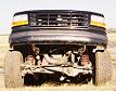 1996 Ford Bronco - Front view of a black 1996 Ford Bronco, highlighting its grille and suspension system.