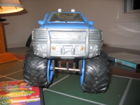 1978 Ford Bronco - This toy truck features oversized tires and a prominent silver grille, resembling a lifted pickup truck.