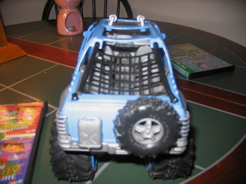 1978 Ford Bronco - Toy truck with off-road tires and a spare tire mounted on the back.