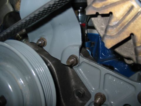 1985 Ford LTD Crown Victoria - Engine component detail showing a belt and pulley system.