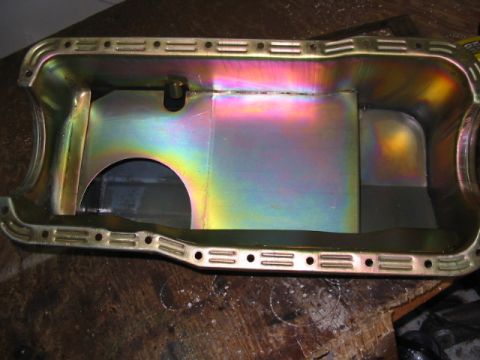1985 Ford LTD Crown Victoria - This oil pan shows rainbow heat discoloration, indicating it has been exposed to high temperatures.