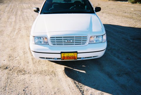 2000 Ford Crown Victoria - Frontal view of a white 2000 Ford Crown Victoria with a Nebraska license plate.