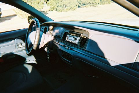 2000 Ford Crown Victoria - Interior view of a 2000 Ford Crown Victoria, highlighting the dashboard and steering wheel.