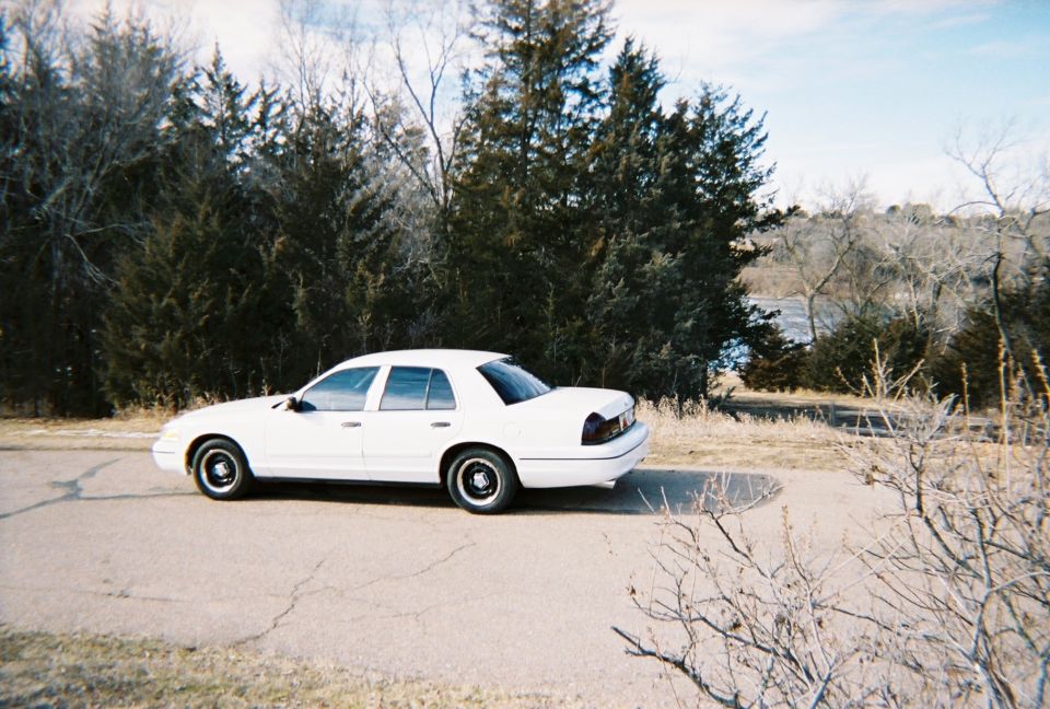 White 2000 Ford Crown Victoria sedan, side view