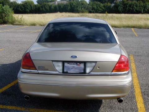 2000 Ford Crown Victoria - Rear view of a 2000 Ford Crown Victoria parked in a lot with yellow lines.