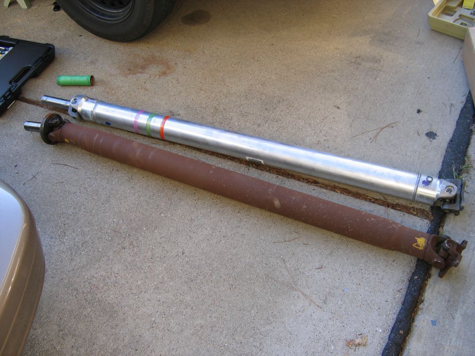 The old driveshaft and the new Al one.