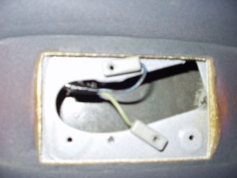 1993 Ford Bronco - Interior view of a dome light housing with exposed wiring and connectors.