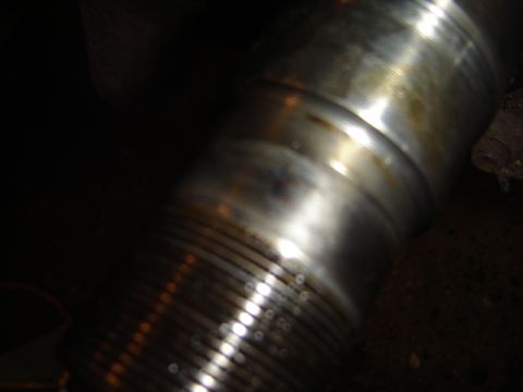 1992 Ford Bronco - This image shows a close-up of a grooved metal shaft, likely a vehicle part.