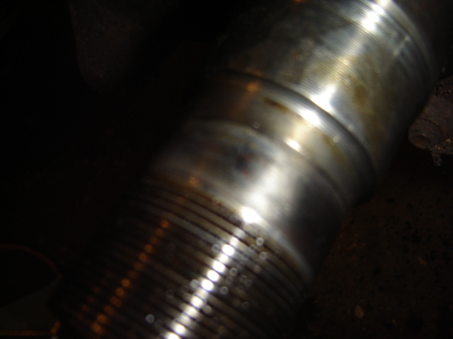 Close-up of a grooved metal shaft, possibly a driveshaft or axle component