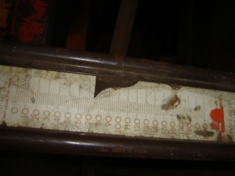 1992 Ford Bronco - A close-up of a weathered scale shows its measurement markings.