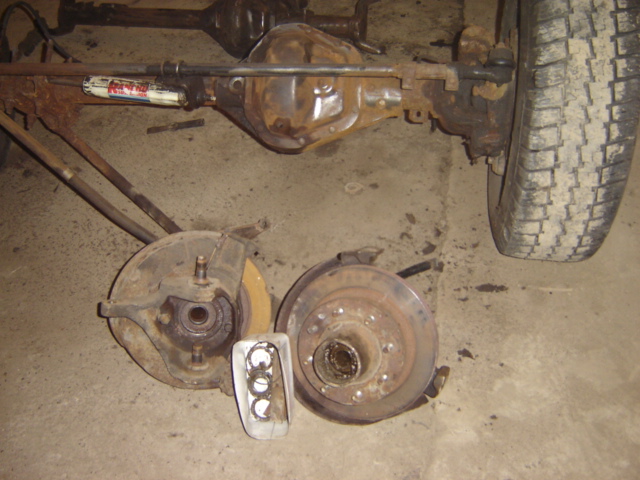 Ford Bronco rear axle assembly with brake components and a tire visible