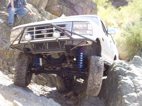 1993 Ford Bronco - This modified Ford Bronco is tackling a challenging rocky trail.
