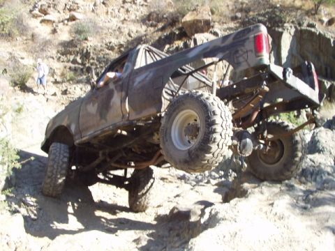 1993 Ford Bronco - This modified 1993 Ford Bronco is shown navigating a steep, rocky incline off-road.