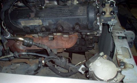 1994 Ford Crown Victoria - Engine components visible in the frame, with a Supermotors.net watermark at the bottom right.