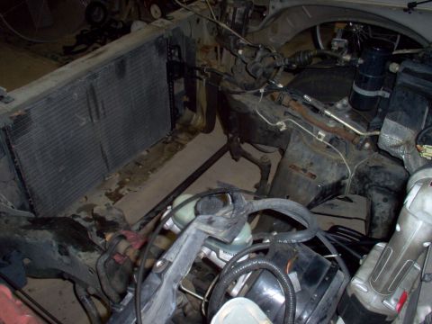 1994 Ford Crown Victoria - Vehicle engine bay with radiator and associated parts removed or exposed.