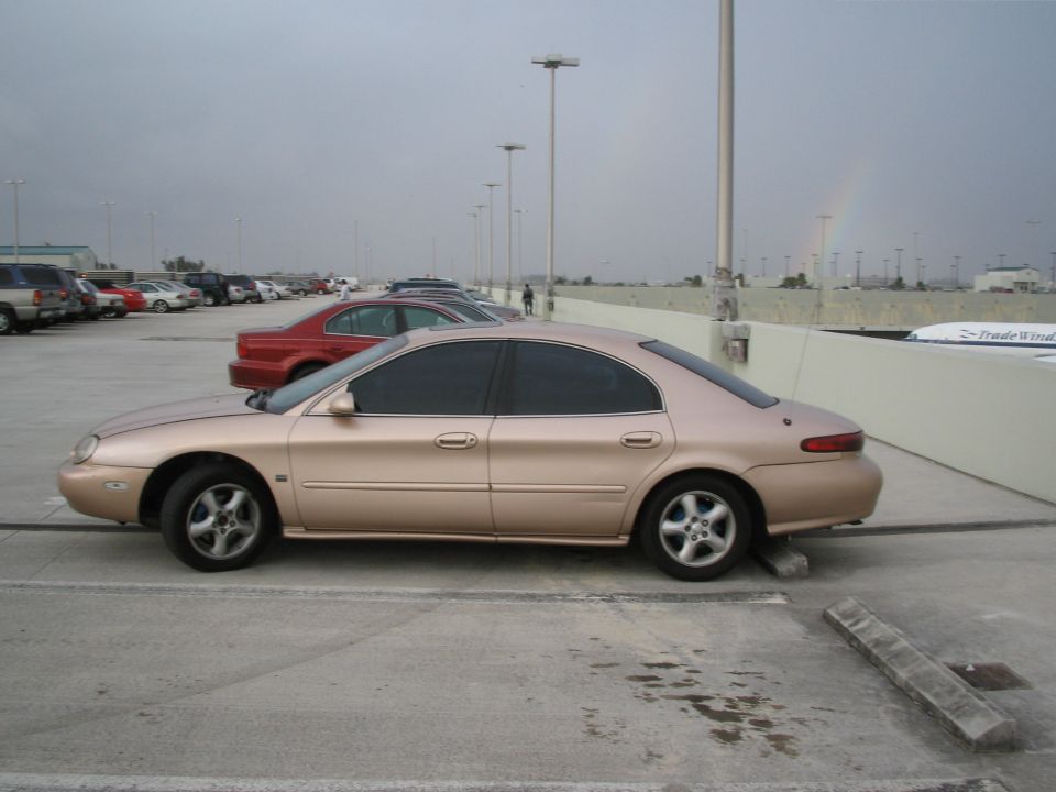 1997 Mercury Sable sedan, side view, tan