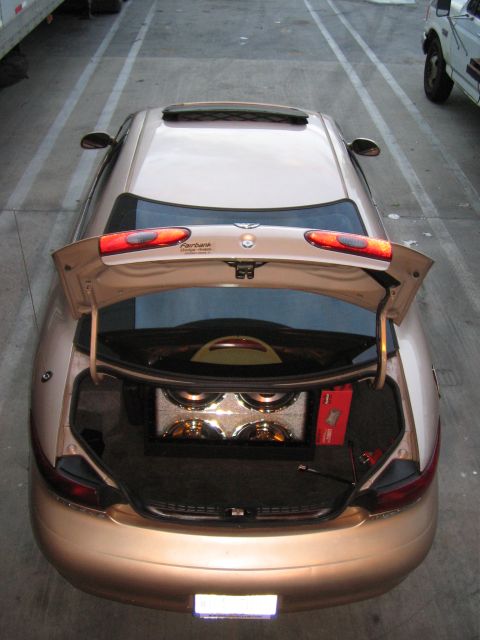 1997 Mercury Sable - Trunk of a 1997 Mercury Sable modified with multiple subwoofers.