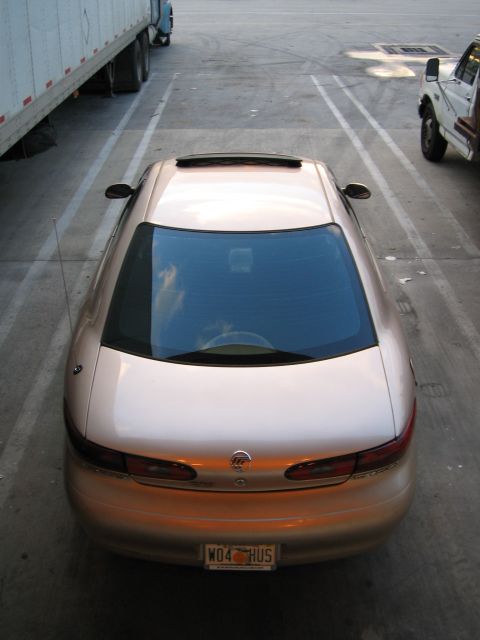 1997 Mercury Sable - Rear view of a 1997 Mercury Sable sedan parked in a lot.