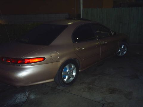 1997 Mercury Sable - Rear 3/4 view of a tan 1997 Mercury Sable sedan.