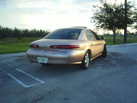 1997 Mercury Sable - Rear view of a 1997 Mercury Sable sedan parked on asphalt.