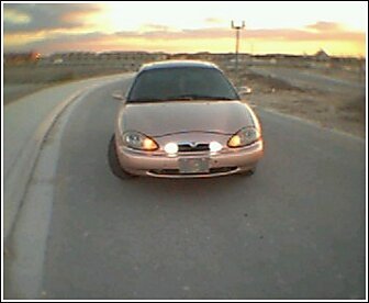 1997 Mercury Sable - Front view of a 1997 Mercury Sable sedan on a road at dusk.