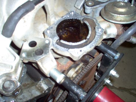 1994 Ford Crown Victoria - Close-up of an engine component showing internal wear and residue.