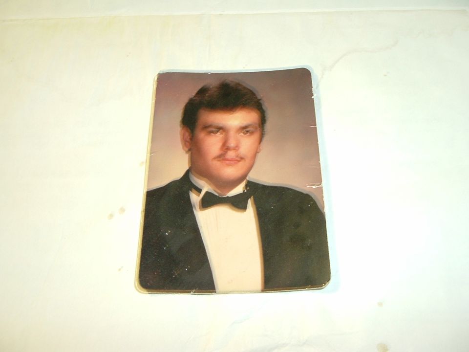 Portrait of a man wearing a tuxedo with a bow tie