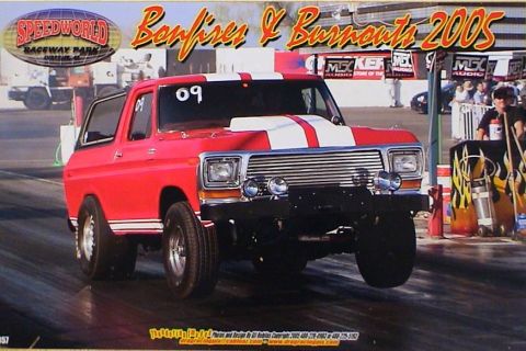 1979 Ford Bronco - A red Bronco with racing stripes is on the drag strip at Speedworld Raceway Park for Bonfires & Burnouts 2005.