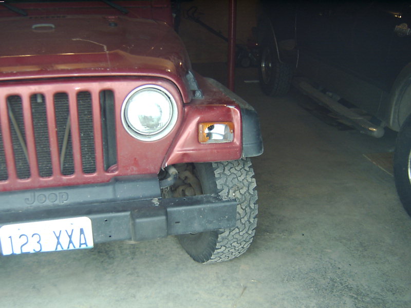 Red 1998 Jeep TJ front corner with license plate 123 XXA