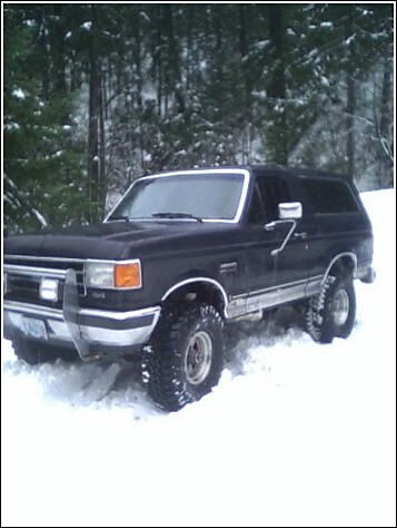 1991 Ford Bronco - This 1991 Ford Bronco is parked in a snowy forest setting.