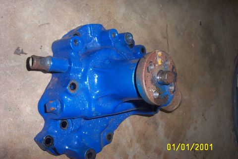1979 Ford F-150 - Water pump part shown on a concrete surface.