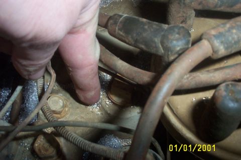 1979 Ford F-150 - A hand points to an engine component, with a date stamp of January 1, 2001 visible in the corner.