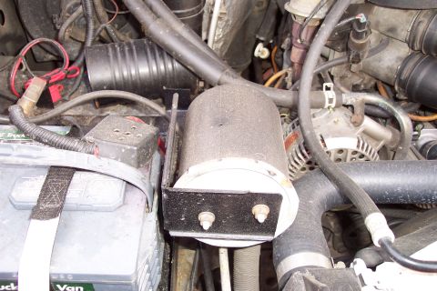 1995 Ford Bronco - had to relocate the filter for the air pump from the wheel well to the side of the tray. I reused the bracket and welded a support onto it…