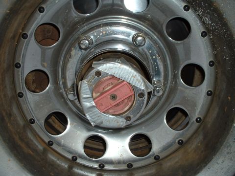 1985 Ford Bronco - Redneck Engineering at its best. I used some duct tape aroud the hub to keep water and mud out of the holes left from the bolts I lost.