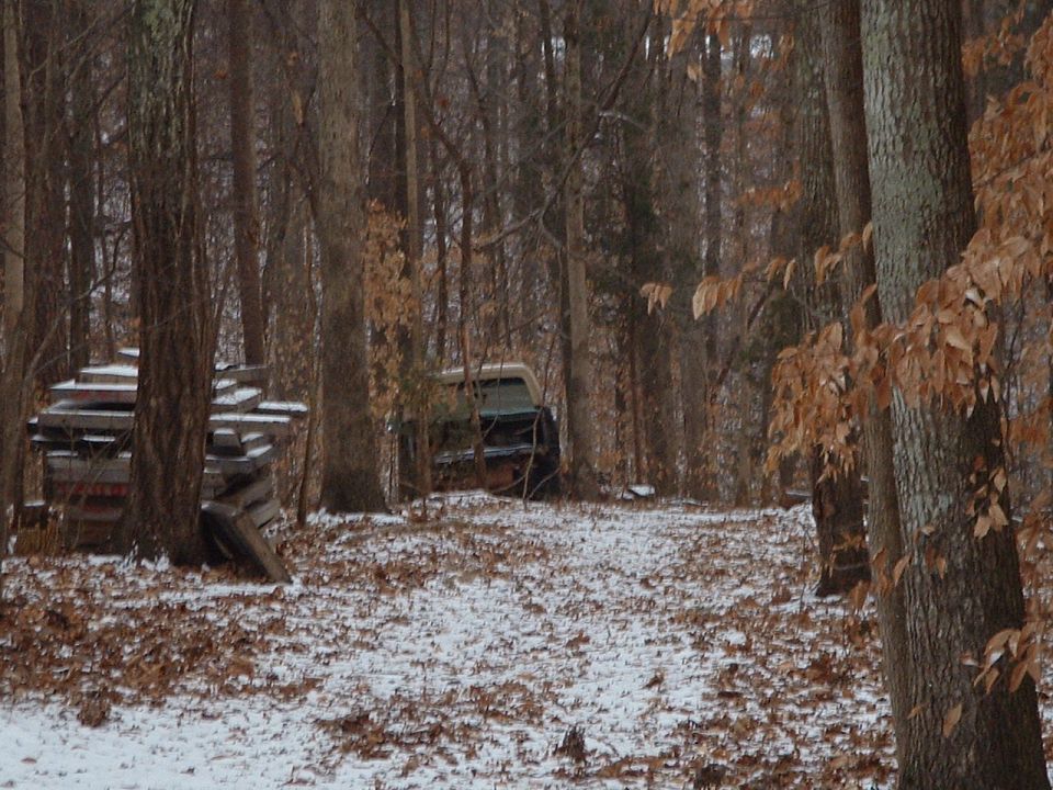 If you look closely you can see the illusive "parts truck" resting peacefully in the snow behind some wall panels and trees.