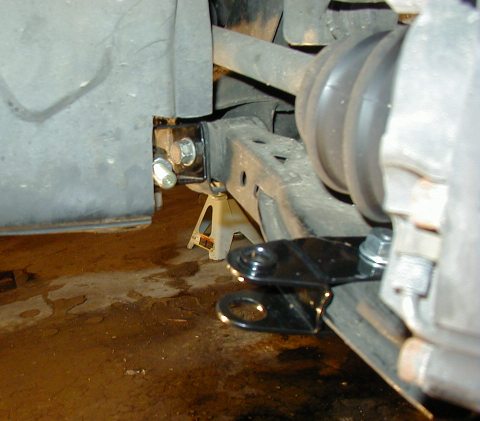 1995 Ford Probe - Aftermarket traction bars are shown installed on the suspension system of a vehicle, supported by jack stands.