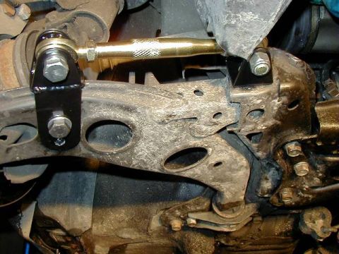 1995 Ford Probe - Aftermarket traction bars installed on the suspension system.