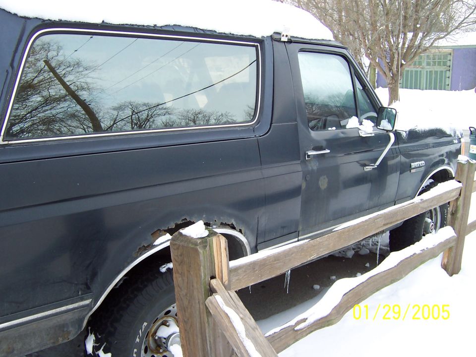 1990 Ford Bronco side view in snow
