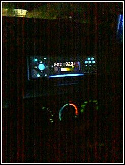 1993 Ford Bronco - The interior of a car shows a radio and climate controls in the dashboard.