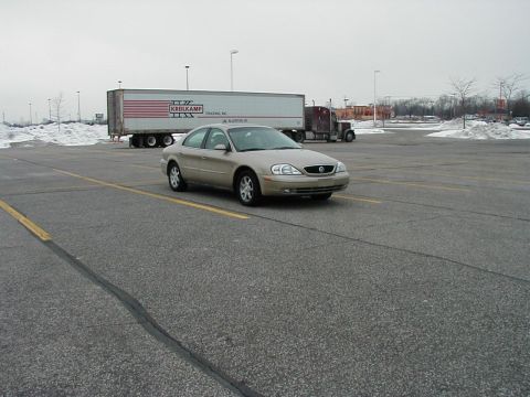 2001 Mercury Sable - A 2001 Mercury Sable is parked in a lot with a semi-truck in the background.