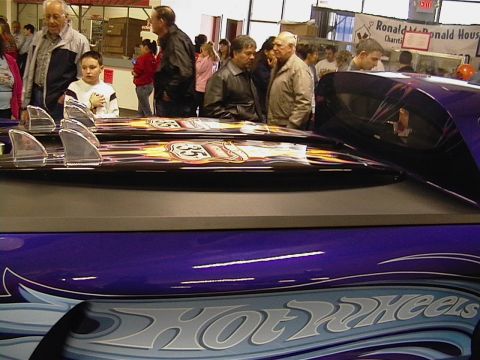 1999 Ford Taurus - Display of Hot Wheels themed items, including custom surfboards with flame graphics.