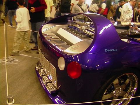 1999 Ford Taurus - A custom purple concept car, identified as 'Deora II', is displayed with its engine compartment open.