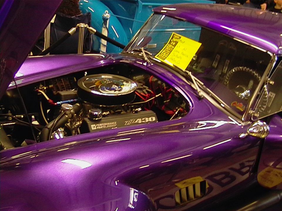 Purple car's engine bay showing a 430 engine and air filter