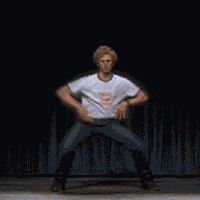 1986 Pontiac Fiero - A man performs a dance routine in front of a dark background.