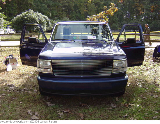 1994 Ford F-150 truck with doors open, parked outdoors